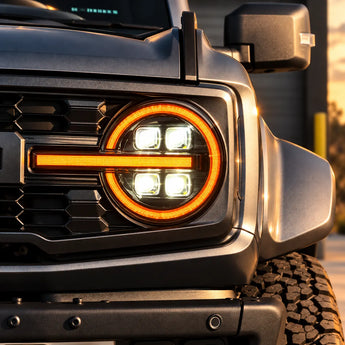 2021-2026 Ford Bronco LED Quad Projector Headlights Assembly — Pair — Amber illuminated headlight close-up — H-BRO21-Q-RGB