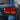 Illuminated PRISMBEAM LED tail light centered in a close-up view on a blue Toyota Land Cruiser.