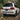 LC200 2016-2021 White Toyota Land Cruiser with illuminated smoked LED tail lights crossing a shallow mountain creek.