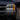 Chevrolet Silverado triple projector headlights with white DRL in rainy dusk | SKU: FLT1-1003-1