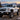 Chevrolet Silverado triple projector headlights with white DRL at alpine sunrise | SKU: FLT1-1003-1