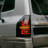 PrismBeam | 2009-2022 Mitsubishi Pajero V73 Smoked LED Tail Lights Set