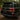 Toyota Land Cruiser with a matching pair of illuminated LED tail lights on a wooded road.